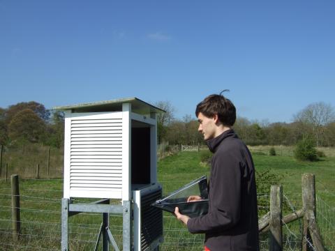 Student recording the manual weather station data
